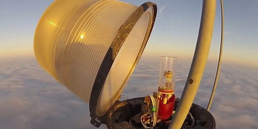 Man climbs a 1,999-foot tower to change a light bulb. It looks just as wild as you'd think.