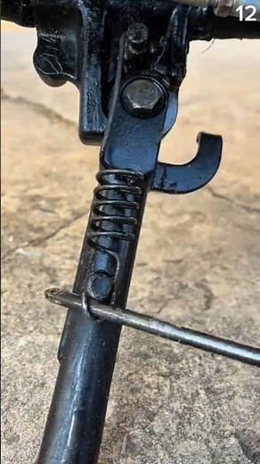 Spring-loaded latch secures metal shaft with tight tension