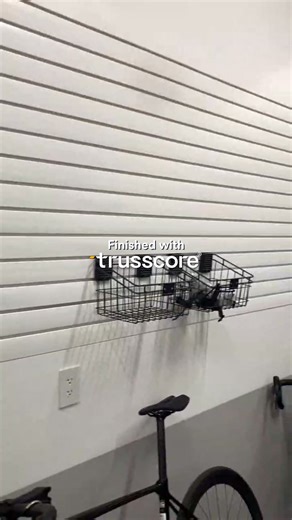 Luxury, redefined—right down to the garage. ✨ This stunning space proves your garage can be just as intentional as the rest of your home. Finished with Trusscore Wall&CeilingBoard and Trusscore SlatWall, the mix of gray and white panels adds contrast, depth, and a truly custom look—without sacrificing durability. Designed by Island Enterprises, this garage blends high-end style with surfaces built to handle real life. Because elevated design, doesn’t stop at the garage door. 🚗🏡 👉 Architects &