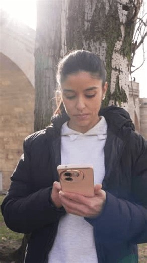 clip-3984595045-athletic-woman-checking-her-fitness-tracker-app