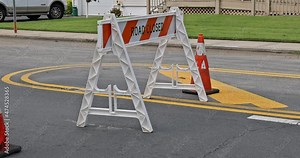 Signs informing about a Road Closed on street repair in a city