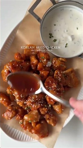 Korean fried chicken with dipping sauce Extra crispy, sticky glaze, creamy dip, pure comfort.