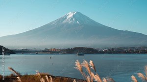 Breathtaking Timelapse of Mount Fuji: Japan's Iconic Volcano at Sunrise, Capturing the Stunning Landscape of Clouds and Sky Reflected in Kawaguchiko Lake, Beautiful Morning Landmark for Travelers