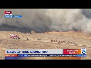 Crews battle Santa Ana wind-fueled Springs Fire in Moreno Valley