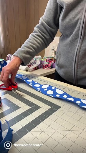 Let’s make a Patriotic deco mesh wreath this week to hang on our front doors for Memorial weekend right through July 4th! #patrioticdecor #patrioticwreath #frontdoorwreath | The Wreath Creator