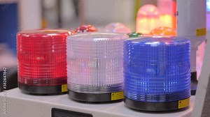 Close up of alarm lamp signal warning flashing light for industrial machinery at emergency, support and services exhibition. Danger, legal, alert light, attention, hazard, manufacturing concept