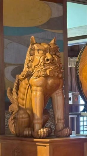A Shrine in Japan with Wooden Guardian Lions