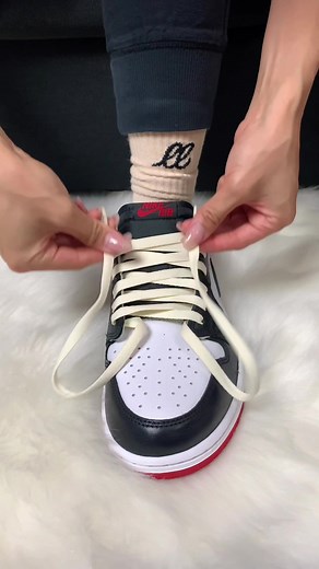 Give your sneakers little vintage touch These Air Jordan 1 Low ‘Black Toe’ share the same color blocking as the 2016 high-top version with its black toe cap, white upper leather and university red heel and outsole. The original ‘Black Toe’ sneaker first released in 1985 and is considered a classic colorway, though not worn as often by Micheal Jordan as the infamous ‘Chicago’ Jordan 1. We love an homage sneaker and had to add our own cream laces to this pair. We used the top-down lacing technique