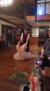 Bride Slips on Wooden Floor and Falls While Dancing With Groom