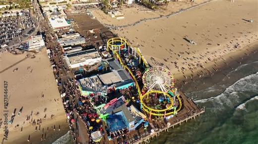 Santa Monica beachfront aerial. Santa Monica coast from sky. Drone view of Santa Monica Pier. Santa Monica ocean panorama.