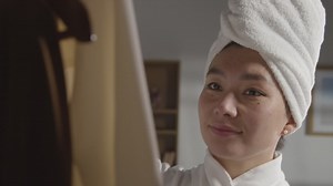 Free stock video - Young woman at home just out of shower choosing business suit from wardrobe for job interview 2