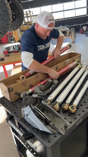 Dustin Mitchell on Instagram: "With the factory control arm brackets cut off @dickindustriesinc and I can now install the @artecindustries front long arm kit in the #toolgridgarage . It’s a bolt on kit and we used the @einhellcanada impact to put the new bolts in a few existing holes and the drill to drill the needed new holes and then we could install the new upper and lower long arm control arms. Well designed system by Artec 👍"