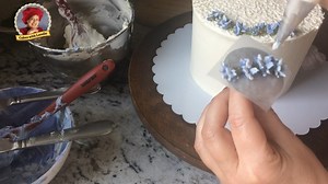 4K views · 107 reactions | Watch this cake come alive with a beautiful wreath of buttercream lavender. Cornelli lace makes the perfect backdrop for this very feminine cake design. #cakeswithloreli #weddingcakesforyou #buttercreamflowers The full detailed tutorial is at Wedding Cakes For You - YouTube. Music Credits: Lady Humming Bird: Cali'co Lift A Glass: Trout Recording | Cakes with Lorelie | Facebook