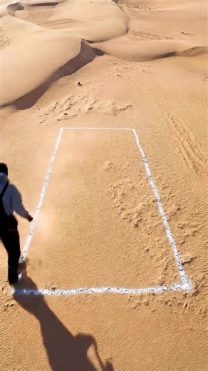 I built a hidden bunker under the desert... It started with nothing but a white rectangle sprayed in the sand. Then the digging began — deeper and deeper into the desert ground. A 3-meter deep pit was carved beneath the surface. Massive wooden logs were stacked across the top to create the roof structure. A hidden wooden hatch was cut directly into the logs. The entrance was sealed with OSB boards, tarp, and desert sand so it blends perfectly with the environment. Completely camouflaged undergro