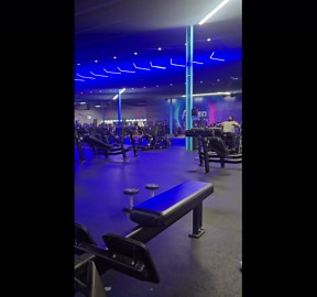 Gentleman pushes through a rowing workout before the machine snaps and throws him backward