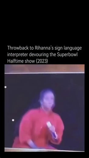 Explaining Hollywood on Instagram: "Throwback to Rihanna’s 2023 Super Bowl Halftime Show, where the sign language interpreter almost stole the spotlight with her electrifying performance. As Rihanna delivered a hit-packed, effortlessly cool set, the interpreter matched every beat, lyric, and attitude with bold, expressive signing that radiated confidence and swagger. Her energy was so infectious that social media instantly lit up, with fans praising how she didn’t just translate the music-she pe