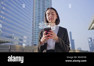 business woman using mobile phone on city background, business technology concept Stock Video Footage - Alamy