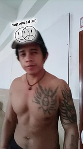 Shirtless Man with Bird Tattoo in Unique Gesture