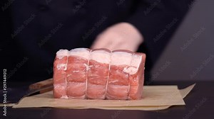 Step by step. Boneless pork roast on brown butcher paper.