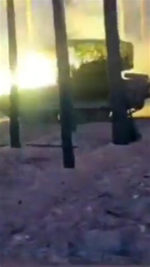 Russian BMP‑2 fitted with a cope cage, firing in the Kremennaya forest