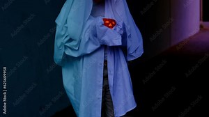 ghost child 10 years old in white hoodie holds pumpkin candle in hands in creepy tunnel, sad boy ghost night, halloween festival concept, frightening mystical events, friday 13th, horror movie scene