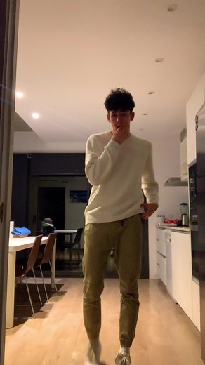 Dynamic Dance Routine in a Contemporary Kitchen