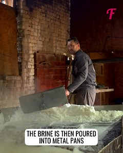 A worker follows an old technology by evaporating salt from brine | Fabiosa Australia