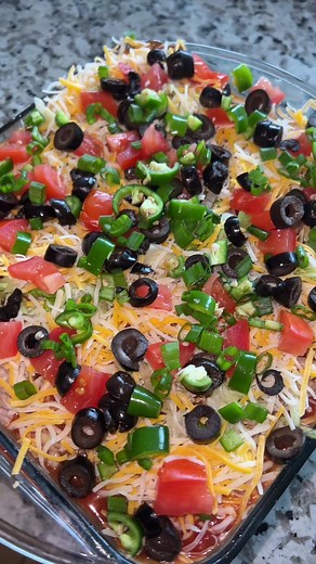 Delicious 7 Layer Dip Recipe with On The Border Tortilla Chips