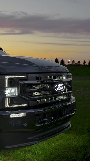 Silver Ford F250 Powerstroke with Lund Visor and Wide Steel Body