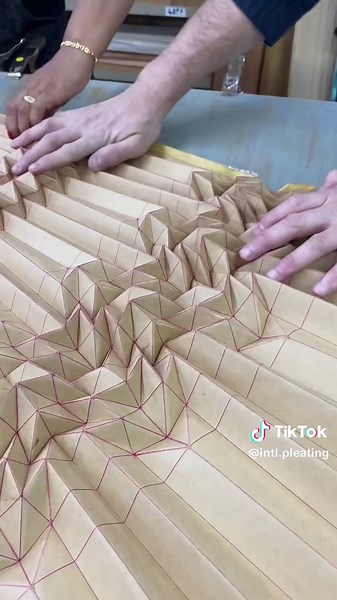 Intricate Fabric Pleating Process in New York Times