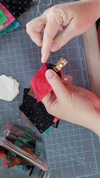 Basting process on this 1" batik and black, pieced hexagon EPP project