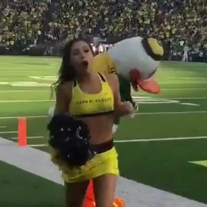 Watch the Oregon mascot nearly decapitate a cheerleader with a golf club (Don't worry, she's OK)