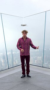 Taking RG to the top of New York City in the High Renown Limited Edition button downAvailable in purple or magenta.. 📸: @itsslavik | Robert Graham