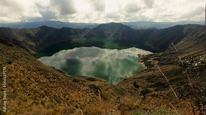 Quilotoa Lagoon Water Filled Crater Lake Ecuador Andes Volcano Aerial Time Lapse of Crystalline Water, Andean Cordillera and Clouds Movement