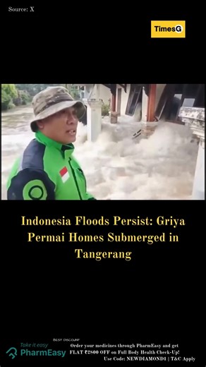 TimesG on Instagram: "Flooding continues Friday morning in Pinang's Griya Permai housing complex, Tangerang City, Banten, Indonesia, with hundreds of homes still inundated by 10–80 cm deep waters and strong currents surging through streets. Triggered by a collapsed embankment breaching via residents' homes on January 23, 2026, the deluge has disrupted daily life, prompting local BPBD teams for pumping and aid amid typical wet-season overflow from nearby rivers and poor drainage. Residents wade t