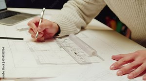 Architect designer drawing close-up. Professional engineer working, interior creator making notes in new house project, blueprint plan, drafting building.