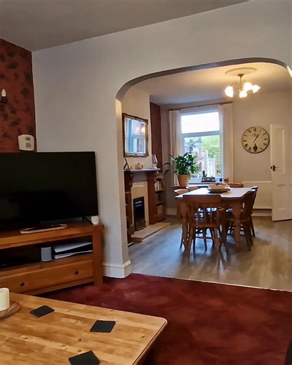 THREE BEDROOM MID TERRACE HOUSE in Coalville. Enter through a small porch boasting an original stained glass window, into the hallway leading to the front dining room with dual windows and is part open plan to the lounge at the rear with feature fireplace. The modern kitchen has fitted wall and base units with integrated oven and hob, understairs storage cupboard and movable breakfast bar. A separate utility behind the kitchen also comprises of fitted units. The downstairs is completed with an o