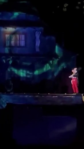 Mickey Mouse slips and falls ... and picks himself up to deliver the pyro!
