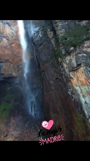 Majestic Waterfall Flowing Down Rocky Cliff