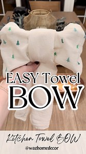 ✨Save this KITCHEN TOWEL BOW to try later!! It’s SUPER EASY and gives your kitchen some holiday spirit. Steps below ⬇️ ✨Grab two of your favorite kitchen towels. ✨Roll first towel up with a 1-2 inch thickness. Fold each end over the center of the towel so there is a small overlap in the center. Use a rubber band or hair tie to secure. ✨Fluff the bow loop on each side. ✨Roll second towel up with a 1-2 inch thickness. Fold in half and place over center of bow to form the bow ends. ✨Tuck in oven or