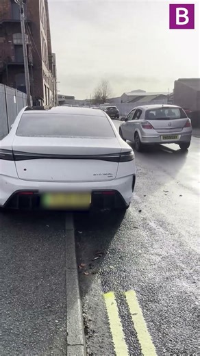 Bonkers council worker paints double yellow lines around parked car in the Midlands