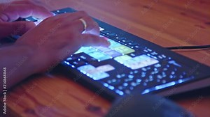 Close up on a backlit video editing keyboard