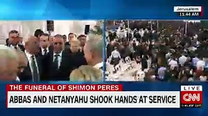 Abbas, Netanyahu shake hands at service