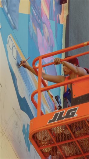 Mr B Baby 🇵🇷 🇲🇽 Michelle Ruby on Instagram: "Excited to share the mural “Juntos” I was selected to create in Boyle Heights for @elaccorg affordable housing units in Boyle Heights. This one’s a very special one. Special thanks to @yamoshi_199x Directed/ Edit / DP by @enkrypt_losangeles Drone Op @yoo.almo PA / Timelapse @aragonrefraction Hair by @stylezbyalisha"