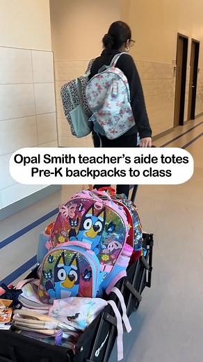 It’s the little things. A teacher’s aide at Opal Smith helps carry all the pre-K backpacks to their classroom while they’re at recess. | Crandall ISD