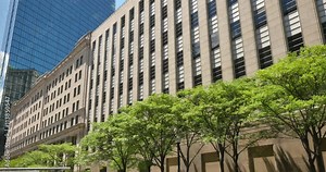 A daytime establishing shot of the John Hancock Building in Boston.