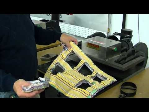 Clicker die cutting press die cutting thick stack of fabric. Tippmann Clicker steel rule die cutter