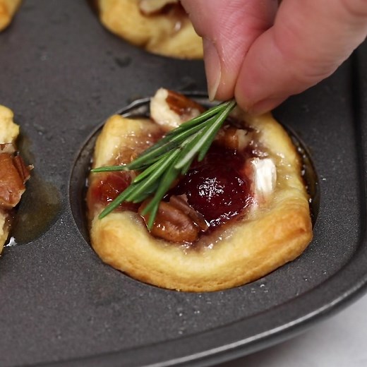 391K views · 2.8K reactions | Cranberry Brie Bites is everyone's favorite appetizer for the holidays! Sweet and tart cranberry on top of creamy brie cheese all piled into a buttery, flaky crescent dough cup. RECIPE: https://www.yellowblissroad.com/cranberry-brie-bites/ | Yellow Bliss Road | Facebook