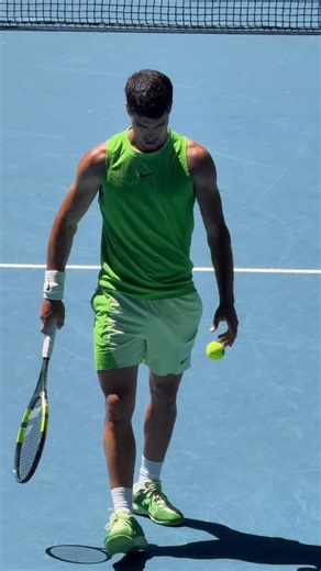 Carlos Alcaraz in Nike’s Mean Green is visual velocity. Against the blue court of Rod Laver Arena, the colour pops with intent. Bright, electric and impossible to ignore, it turns every movement into a blur of speed and power. The contrast makes him look like a human tennis ball in flight. Explosive off the ground, relentless through the court and built for chaos at full throttle. Some colours decorate the game. This one accelerates it. When the colour moves this fast, you stop reacting and star