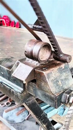 Metal rod bent by clamp press, crisp rhythm of morning fabrication craft